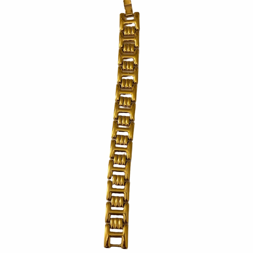 Signed Monet vintage gold- tone articulated link bracelet fold over clasp. 8”